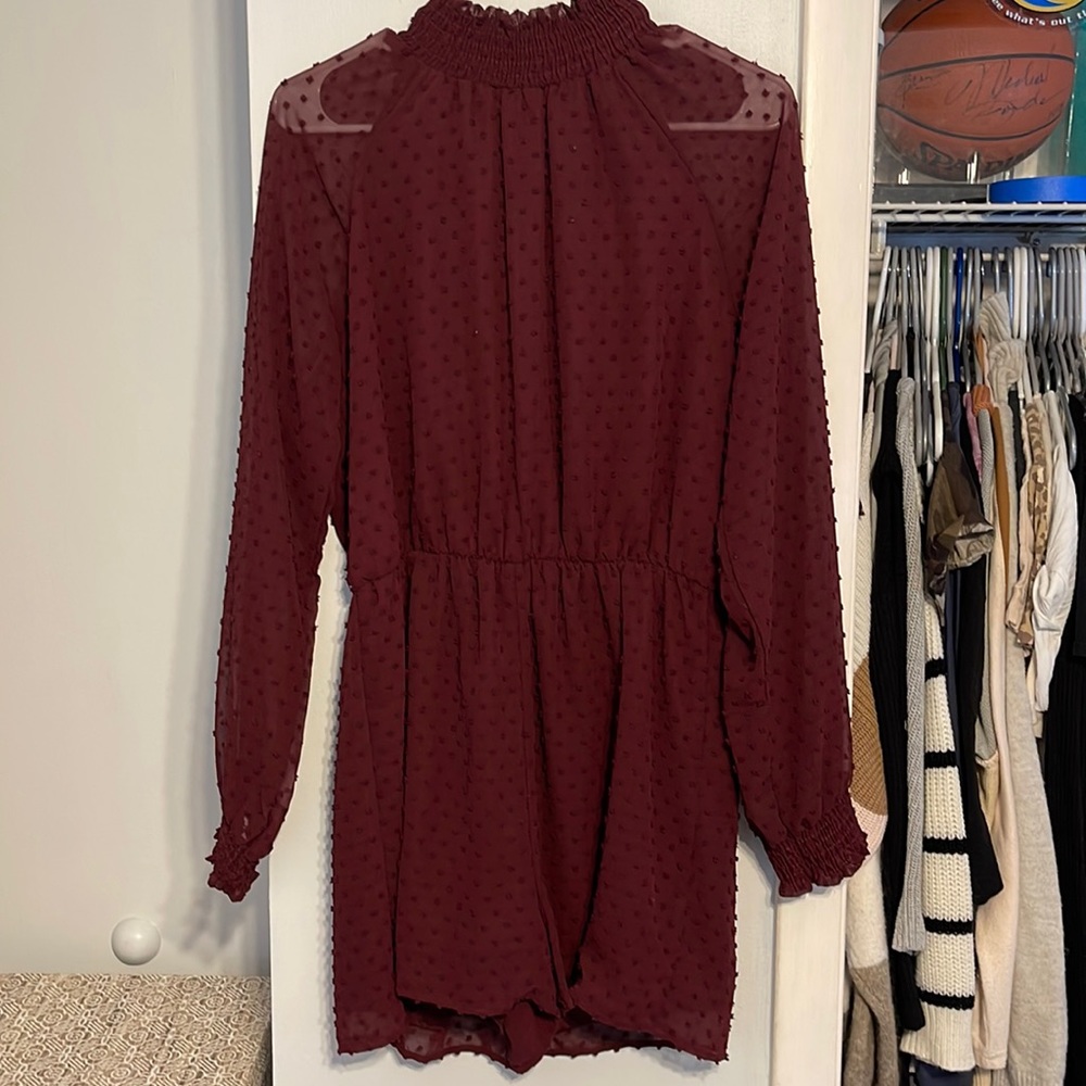 High neck, open back romper, with a duffle polka dot detail